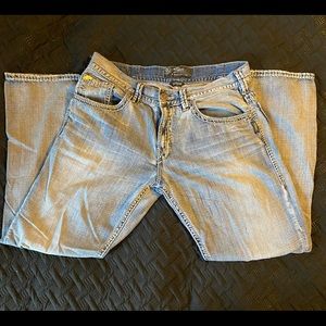 SILVER 36x32 (Gordie style) loose fit. Two small blemishes back pocket & leg.